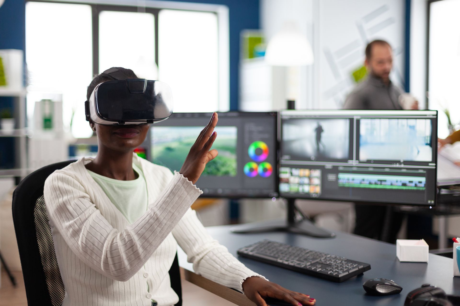 Creative professional using a VR headset while editing