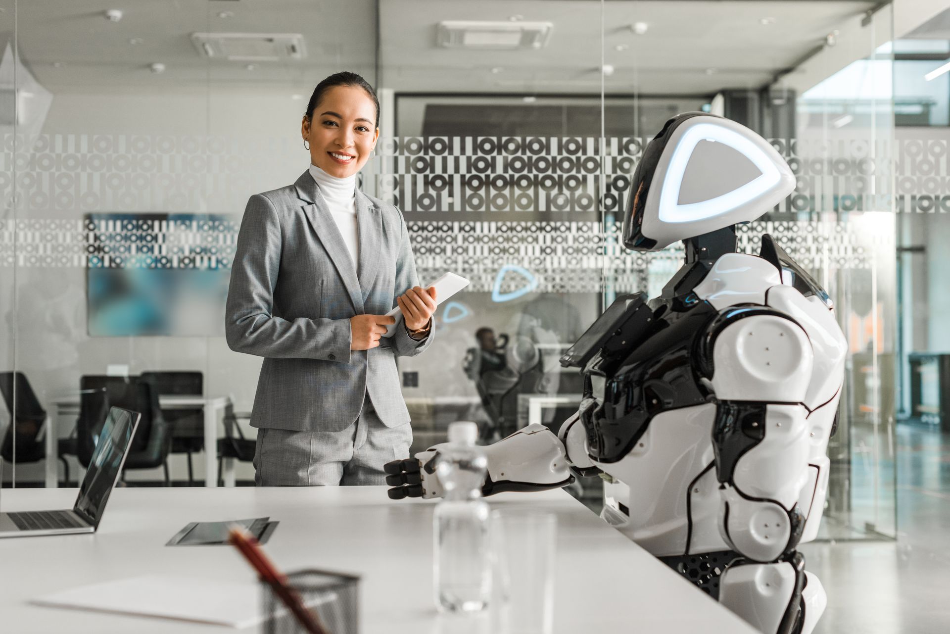 Professional working alongside a robot assistant